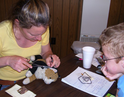 Cross 7 is full service.  Dr. Liz sews up a young client's 'stuffed' pet.